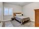 Cozy bedroom with carpeted floors and wood furniture at 61 Western Sky Cir, Longmont, CO 80501