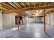 Unfinished basement with high ceilings and ample storage space at 4270 Defoe St, Strasburg, CO 80136