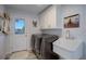 Laundry room featuring a utility sink, washer, dryer, and ample cabinet storage at 11251 Forest Hills Dr, Parker, CO 80138