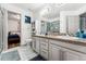 Double vanity bathroom with view into bedroom at 1710 Sunlight Dr, Longmont, CO 80504