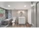 Updated bathroom features a walk-in shower, white vanity, and gray tile at 4445 Milwaukee St, Denver, CO 80216