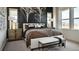 Spacious bedroom with plush bedding, large windows, and modern decor at 16975 Black Rose Cir, Parker, CO 80134