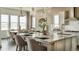 Gourmet kitchen with large island, modern appliances, and plenty of natural light at 16975 Black Rose Cir, Parker, CO 80134