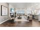 Bright living room with fireplace and access to balcony at 16975 Black Rose Cir, Parker, CO 80134