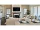 Spacious living room with a fireplace and large windows at 16975 Black Rose Cir, Parker, CO 80134