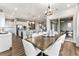 Open concept kitchen with island, stainless steel appliances, and hardwood floors at 16975 Black Rose Cir, Parker, CO 80134