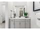 Clean and modern bathroom vanity with a large mirror and a single sink at 16975 Black Rose Cir, Parker, CO 80134