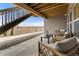 Covered patio with seating area, offering a relaxing outdoor space at 16975 Black Rose Cir, Parker, CO 80134