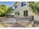 Concrete patio with metal railing and access to the house at 10297 Royal Eagle St, Highlands Ranch, CO 80129