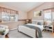 Bright bedroom with hardwood floors and neutral decor at 8732 Snowbird Way, Parker, CO 80134