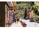 View of a quaint town street with shops and pedestrians at 2121 Hummingbird Way # 106, Georgetown, CO 80444