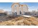 Backyard with patio, shed, and wooden fence at 5411 Elm Ct, Denver, CO 80221