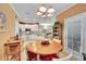 Bright dining area adjacent to the kitchen at 7551 Pineridge Trl, Castle Pines, CO 80108