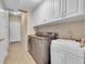 Laundry room with washer, dryer, and utility sink at 7551 Pineridge Trl, Castle Pines, CO 80108