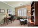 Home office with built-in shelving and a comfortable chair at 7551 Pineridge Trl, Castle Pines, CO 80108