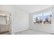 Bright bedroom with large window and view, and an ensuite bathroom at 461 Interlocken Blvd # 101, Broomfield, CO 80021