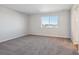 Bright bedroom with carpet and a large window at 7375 S Waterloo Way, Aurora, CO 80016