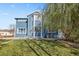 Large backyard with grassy area, partially covered in snow at 12956 E 107Th Pl, Commerce City, CO 80022