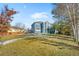 Large backyard with grassy area, partially covered in snow at 12956 E 107Th Pl, Commerce City, CO 80022