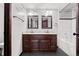 Shared bathroom with double sinks and a tub at 12956 E 107Th Pl, Commerce City, CO 80022