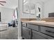 Bathroom with vanity and a view into the bedroom at 12956 E 107Th Pl, Commerce City, CO 80022