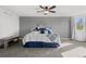 Comfortable bedroom with carpeted floors and large window at 12956 E 107Th Pl, Commerce City, CO 80022