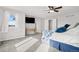 Bright bedroom with a TV mount and large window at 12956 E 107Th Pl, Commerce City, CO 80022