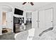 Spacious bedroom with a desk setup, TV, and large closets at 12956 E 107Th Pl, Commerce City, CO 80022