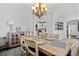 Elegant dining room featuring a wooden table and chandelier at 12956 E 107Th Pl, Commerce City, CO 80022