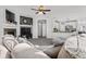 Open Gathering room with a kitchen view and fireplace at 12956 E 107Th Pl, Commerce City, CO 80022