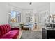 Bright home office with a red couch, and French doors at 12956 E 107Th Pl, Commerce City, CO 80022