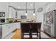 Bright kitchen with granite countertops, stainless steel appliances, and an island at 12956 E 107Th Pl, Commerce City, CO 80022