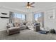 Relaxing living room with sectional sofa and large windows at 12956 E 107Th Pl, Commerce City, CO 80022
