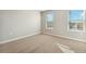 Well-lit bedroom with carpet and neutral wall colors at 3036 Oxley St, Strasburg, CO 80136