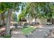 Backyard patio with seating area and mature trees at 7225 Newton St, Westminster, CO 80030