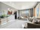 Spacious living room with gray walls and neutral colored couches at 7630 Pecos St, Denver, CO 80221