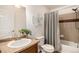 Bathroom with tub, shower, and single vanity at 3655 Akron St, Denver, CO 80238