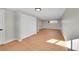 Spacious living area with light wood floors and closet at 765 E Panama Dr, Centennial, CO 80121