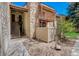 View of building exterior with stairs leading to unit entrance and patio at 7870 W 87Th Dr # J, Arvada, CO 80005