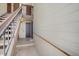 Indoor stairwell leading to upper level of the condo building at 7870 W 87Th Dr # J, Arvada, CO 80005