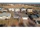 Aerial view of the property and surrounding neighborhood with a highlighted lot line at 3825 E 123Rd Ave, Thornton, CO 80241