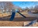 Neighborhood playground with slides, climbing bars, and a bench at 3825 E 123Rd Ave, Thornton, CO 80241