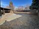 Large backyard with gravel and covered patio at 2084 S Rifle St, Aurora, CO 80013