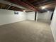 Large finished basement area with carpeted floor at 2084 S Rifle St, Aurora, CO 80013