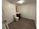 Basement bathroom with toilet, vanity, and mirror at 2084 S Rifle St, Aurora, CO 80013