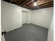 Finished basement room with gray flooring and neutral walls at 2084 S Rifle St, Aurora, CO 80013