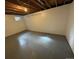 Finished basement room with gray flooring and neutral walls at 2084 S Rifle St, Aurora, CO 80013