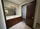 Bathroom with vanity, mirror, and separate shower at 2084 S Rifle St, Aurora, CO 80013