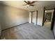 Bedroom with double door closet and access to hallway at 2084 S Rifle St, Aurora, CO 80013