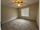 Bright bedroom with ceiling fan and carpeted floor at 2084 S Rifle St, Aurora, CO 80013